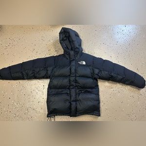 The North Face black puffer jacket.